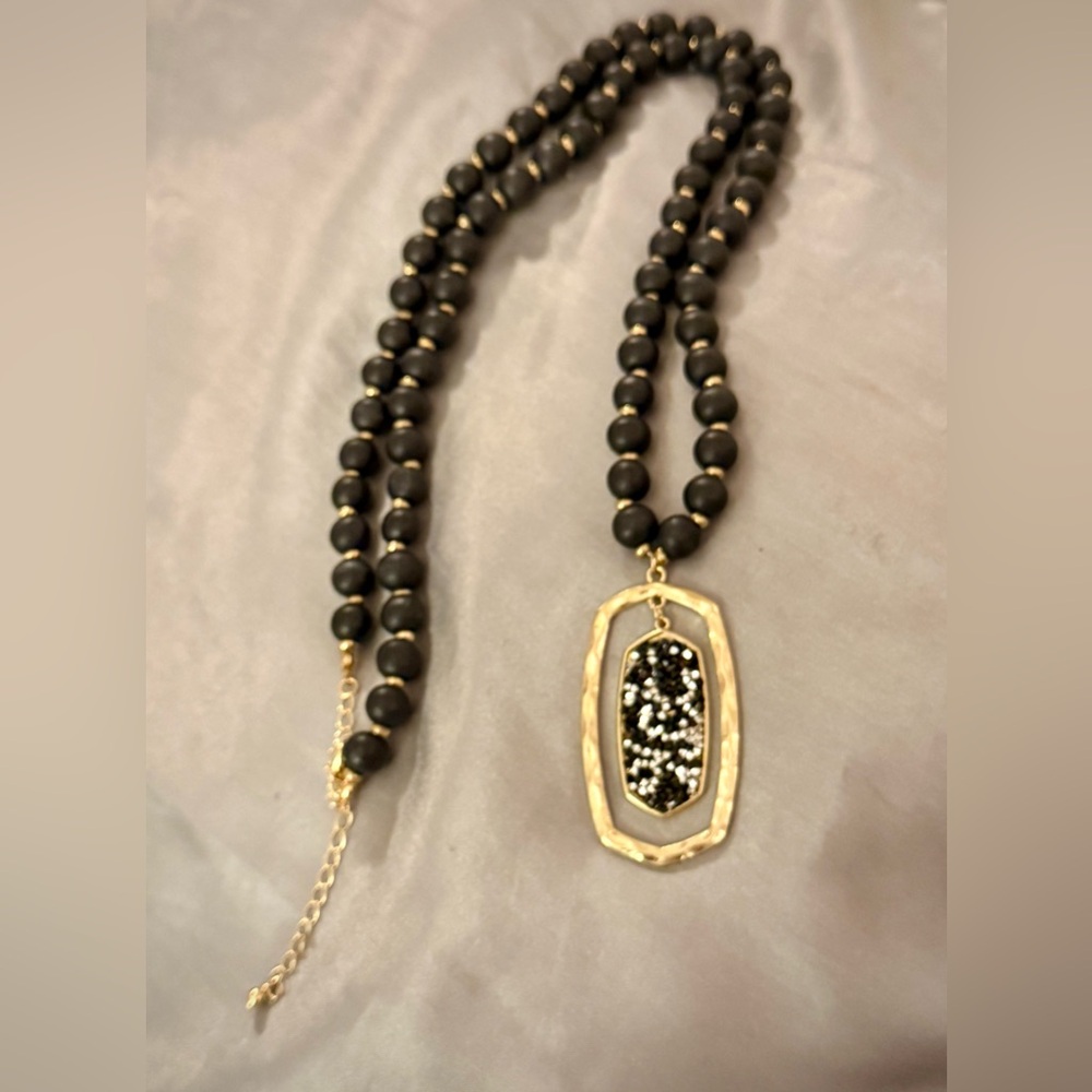 Boho Necklace Striking Contrast Of Matte Black Beads, And A Sparkling Medallion